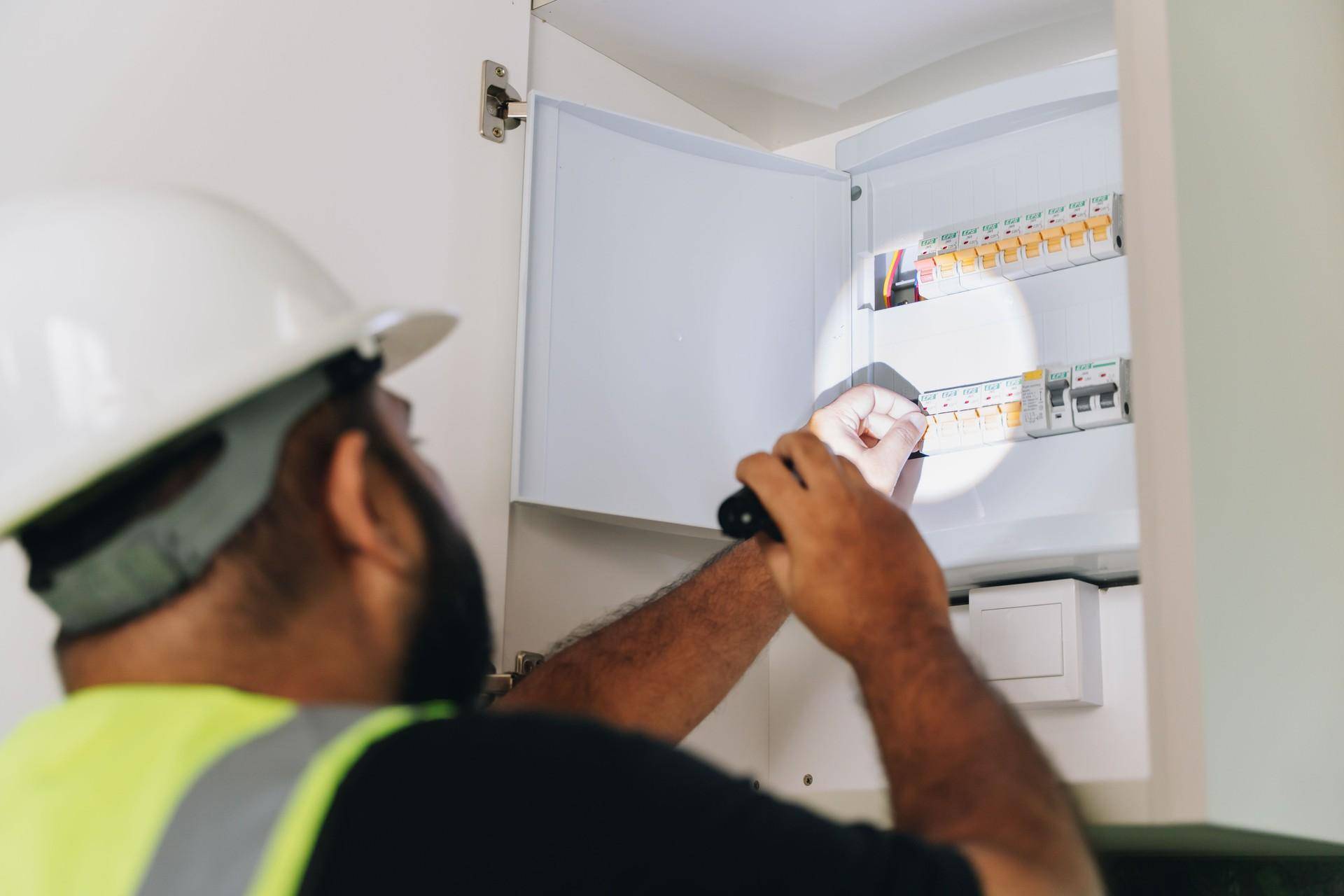 Electrician checking on the electric circuit board