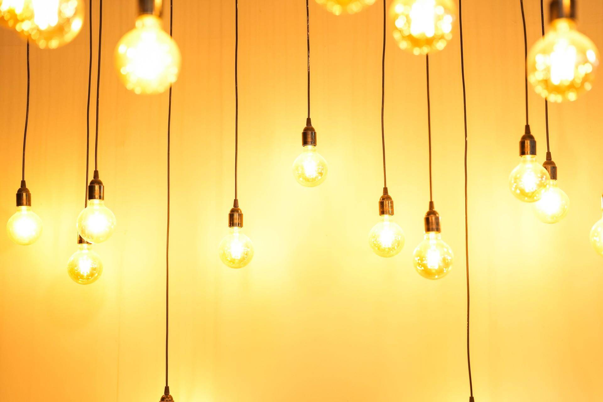 wall background with yellow light bulbs