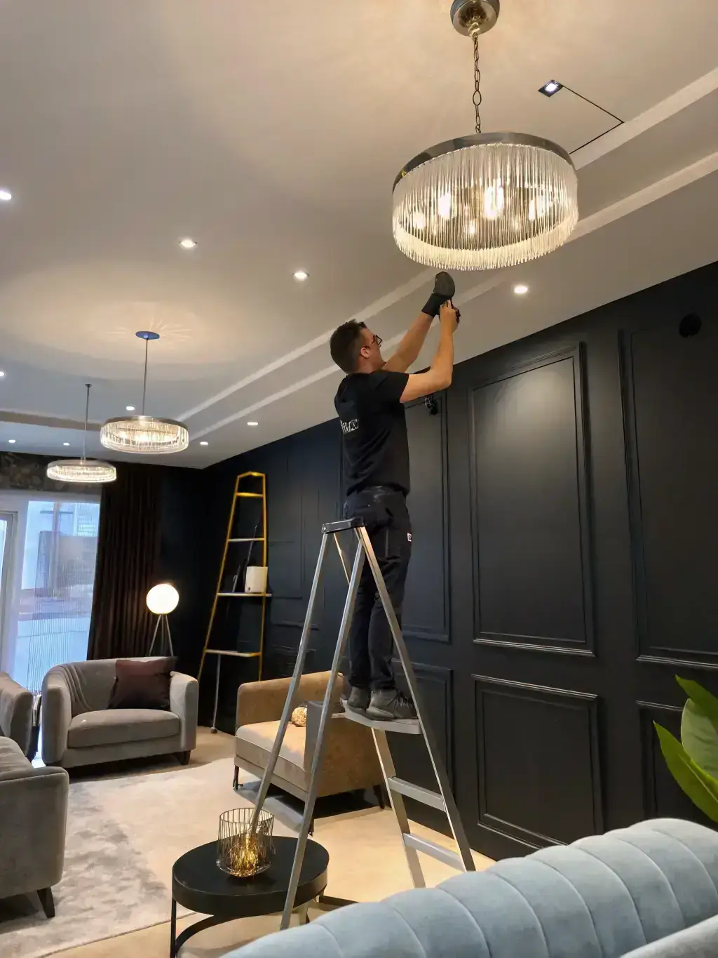 A photo of an electrician installing LED lighting in a modern kitchen, showcasing the versatility and aesthetic appeal of LED fixtures in residential settings, perfect for promoting LED lighting services.